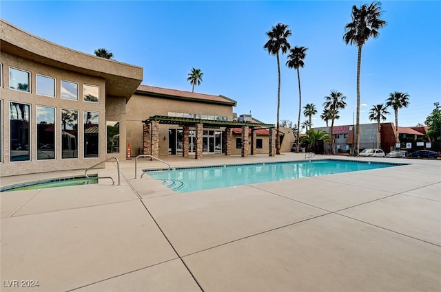 pool featuring a patio area