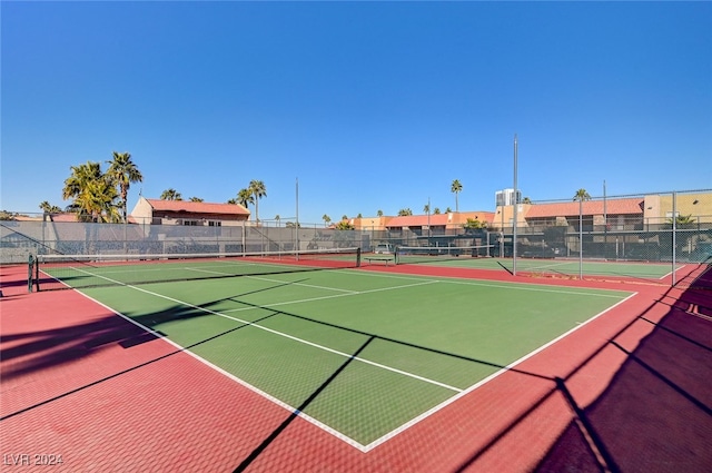 view of sport court featuring community basketball court and fence