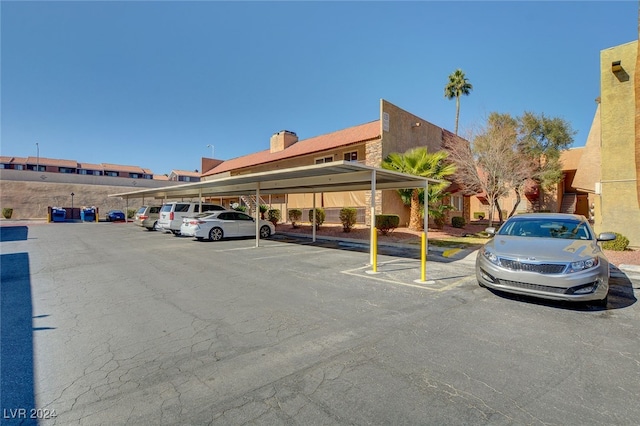 view of partially covered parking lot