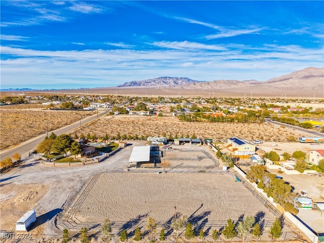 birds eye view of property with a mountain view