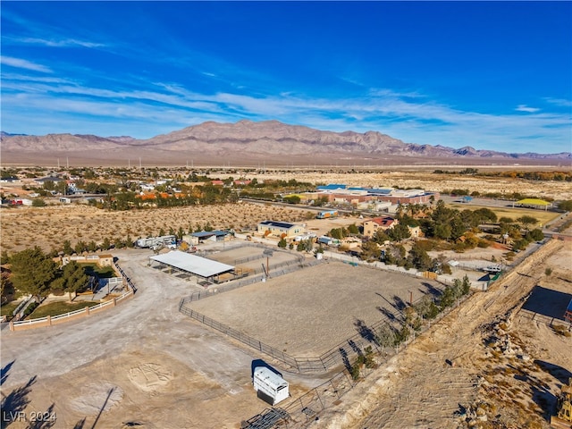 birds eye view of property with a mountain view