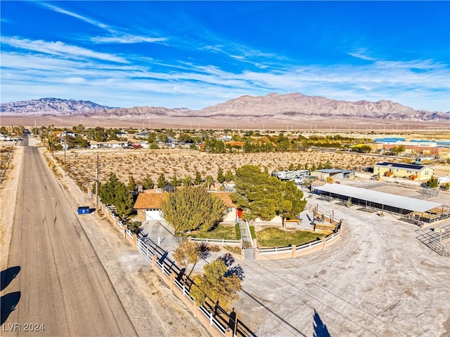 birds eye view of property featuring a mountain view