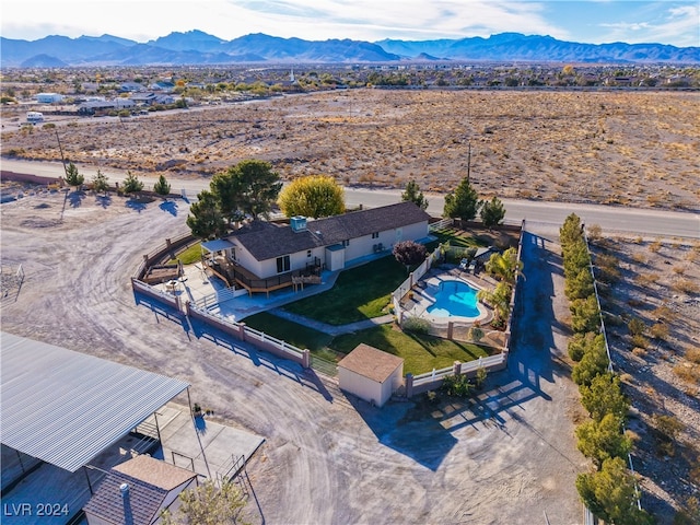 birds eye view of property featuring a mountain view