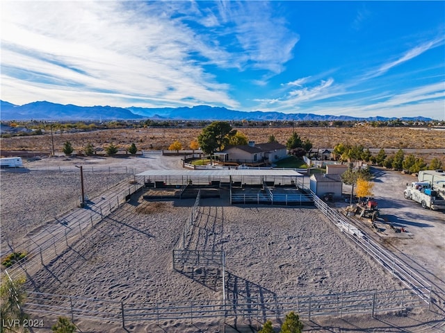 birds eye view of property with a mountain view