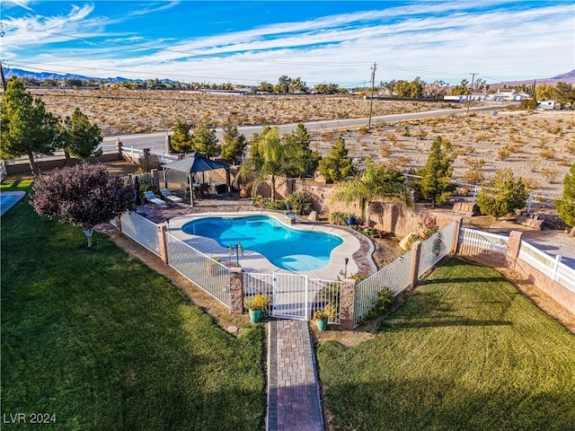 view of swimming pool with a lawn, a gazebo, and a patio