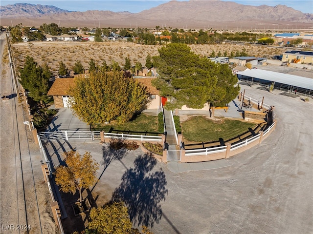 birds eye view of property with a mountain view