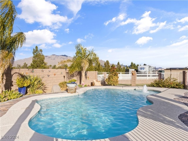 view of pool featuring pool water feature and a mountain view