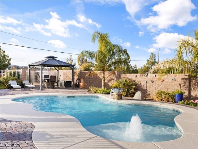 view of pool with a gazebo, pool water feature, and a patio