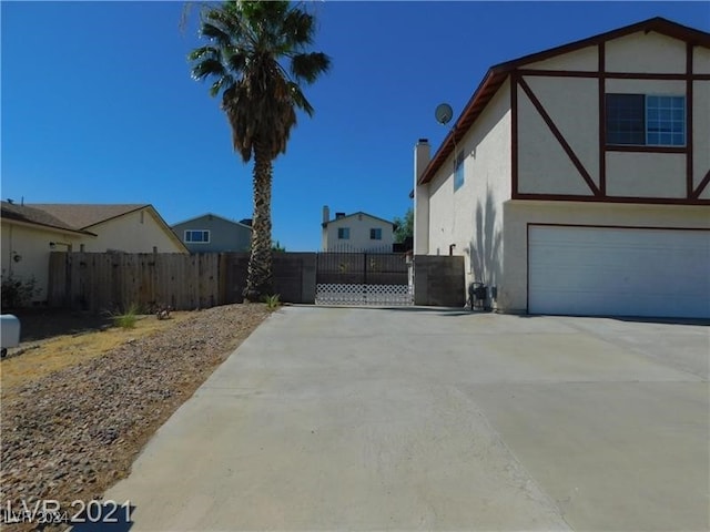 view of side of home featuring a garage