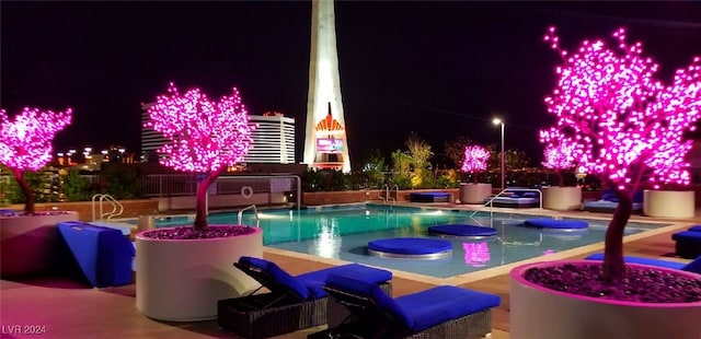 view of pool at night