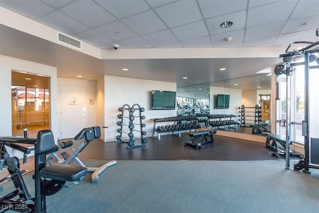 workout area with a paneled ceiling