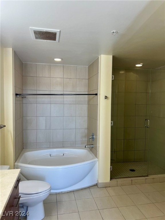 full bathroom with tile patterned floors, plus walk in shower, vanity, and toilet