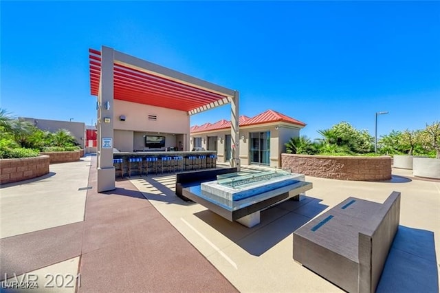 view of patio / terrace with an outdoor bar