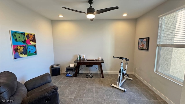 workout room with tile patterned floors and ceiling fan