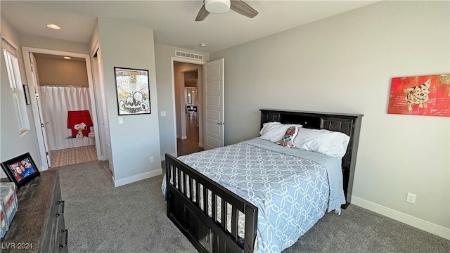 bedroom featuring ceiling fan and dark carpet