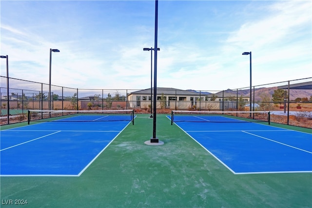 view of sport court with basketball hoop