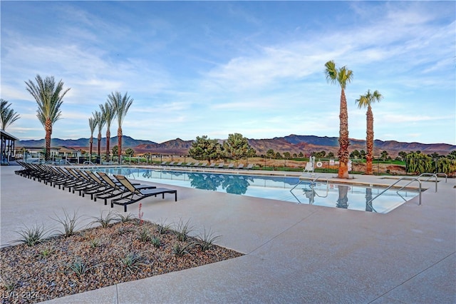 view of swimming pool featuring a mountain view