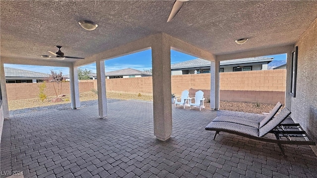 view of patio featuring ceiling fan