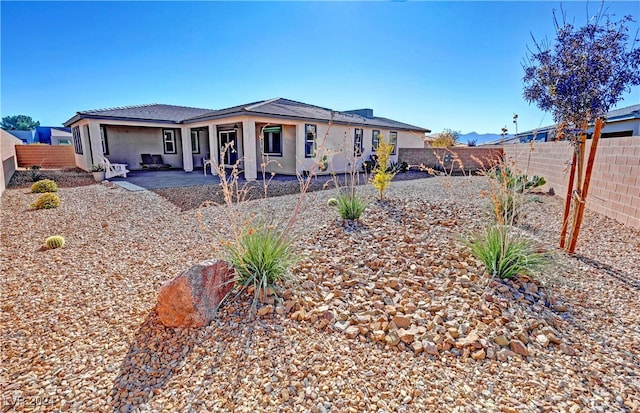 single story home featuring a patio area