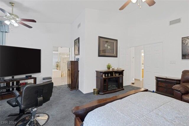 bedroom featuring ceiling fan, connected bathroom, and carpet flooring