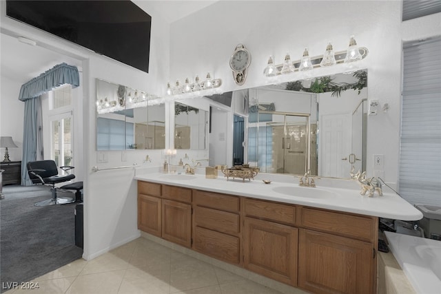 bathroom featuring separate shower and tub, vanity, and tile patterned floors