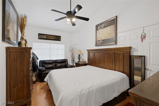 bedroom with ceiling fan and hardwood / wood-style flooring