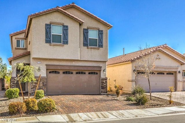 view of front of property with a garage