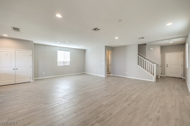 unfurnished living room with light hardwood / wood-style floors