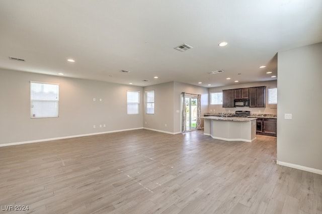 unfurnished living room with light wood-type flooring