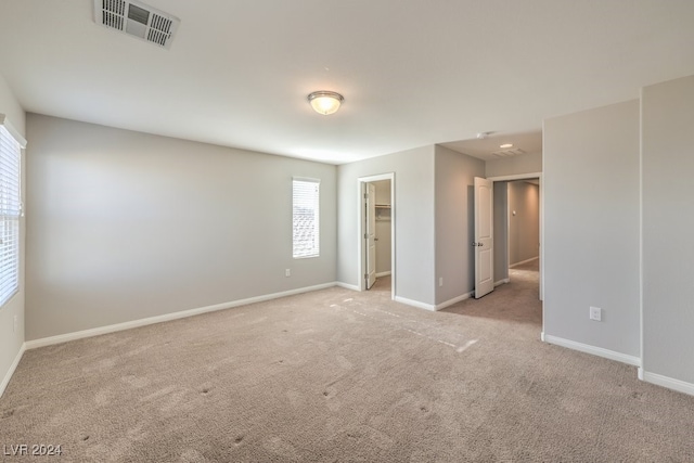 empty room featuring light colored carpet