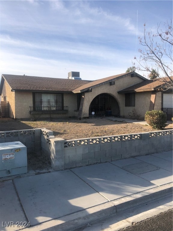 ranch-style home with central AC unit