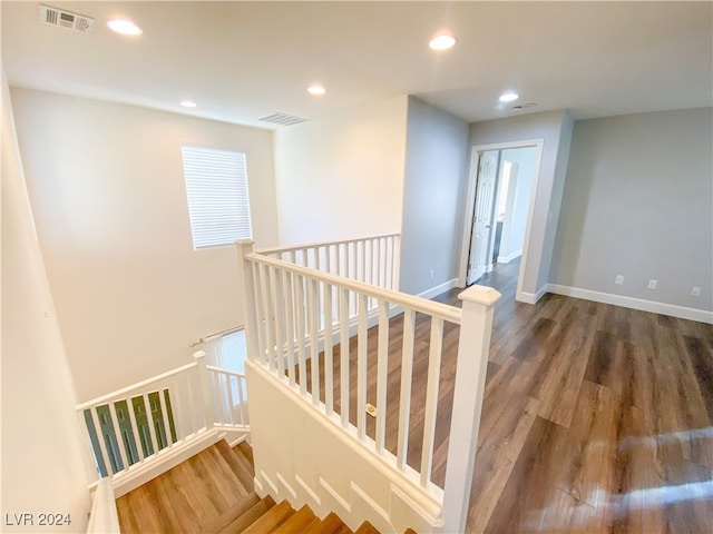 stairway featuring hardwood / wood-style floors