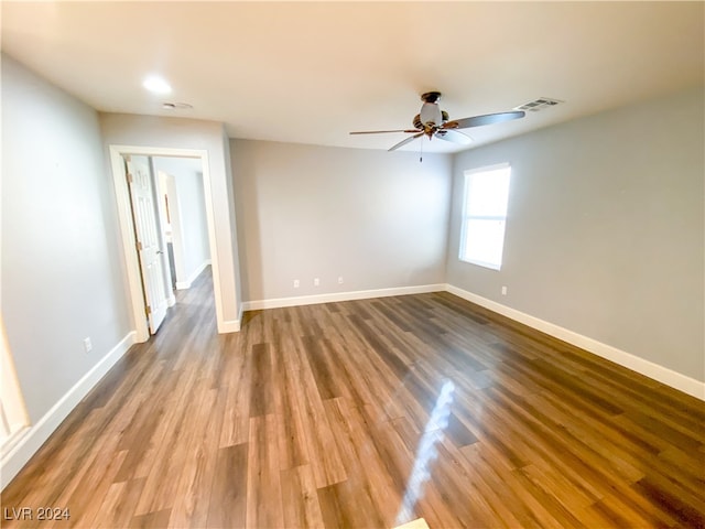 unfurnished room with wood-type flooring and ceiling fan