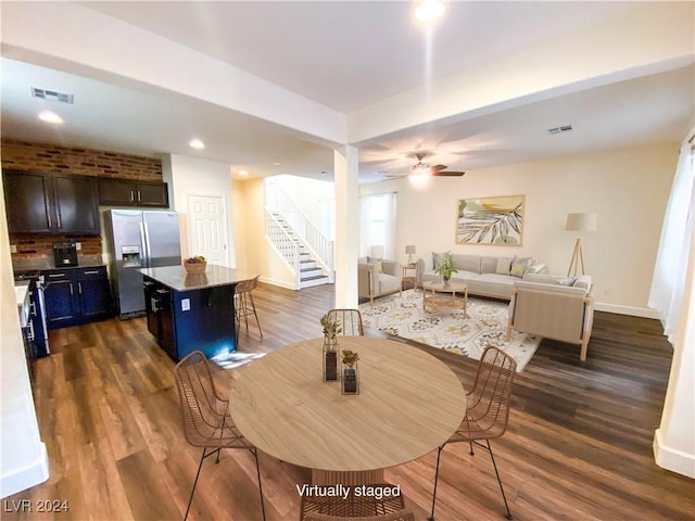 dining area featuring dark hardwood / wood-style floors and ceiling fan