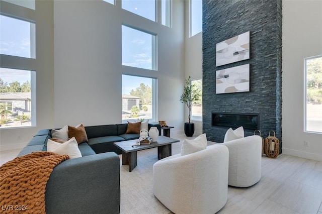 living room featuring plenty of natural light and a high ceiling