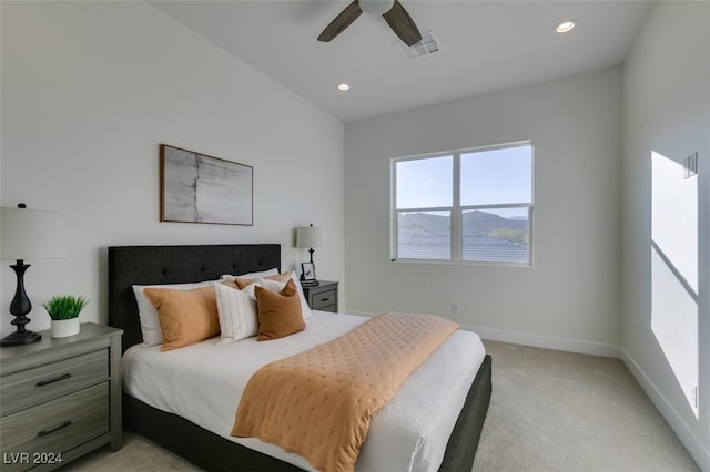 bedroom with light carpet and ceiling fan