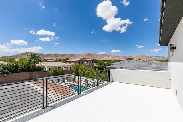 view of patio / terrace featuring a mountain view and a balcony