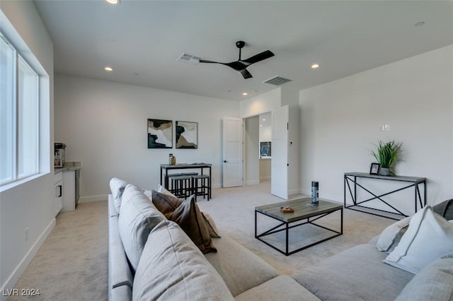 living room featuring ceiling fan and light carpet