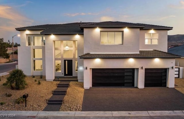 prairie-style house featuring a garage