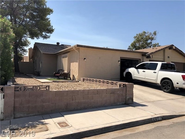 ranch-style house featuring a garage