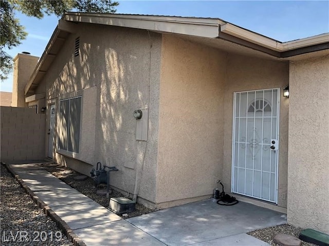 doorway to property featuring a patio area