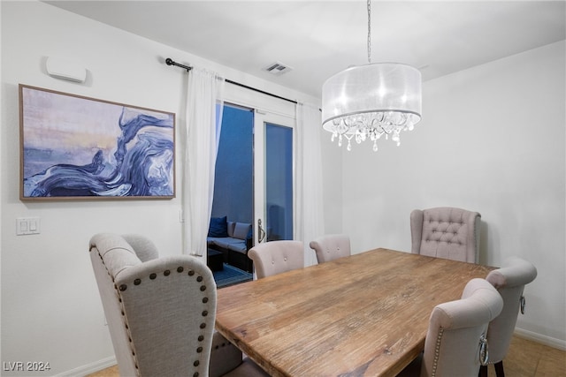 dining room featuring a chandelier