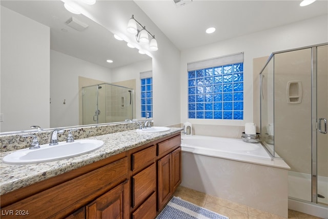 bathroom with vanity, separate shower and tub, and tile patterned floors