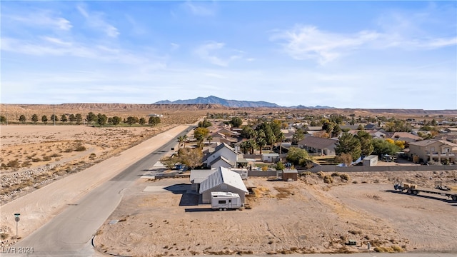 birds eye view of property featuring a mountain view