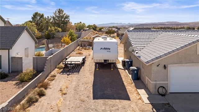 birds eye view of property with a mountain view