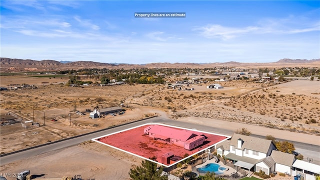 drone / aerial view featuring a mountain view