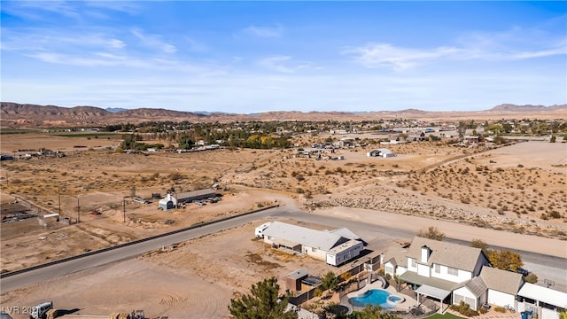 birds eye view of property with a mountain view