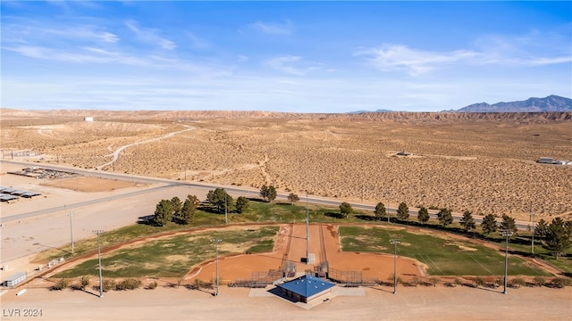 birds eye view of property with a mountain view