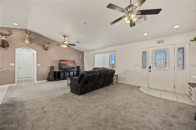 living room featuring light carpet, vaulted ceiling, and ceiling fan