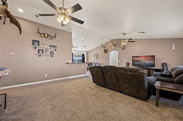 carpeted living room with vaulted ceiling